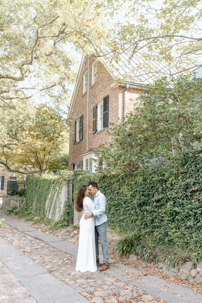 Couple posing for engagement photography downtown Charleston, South Carolina