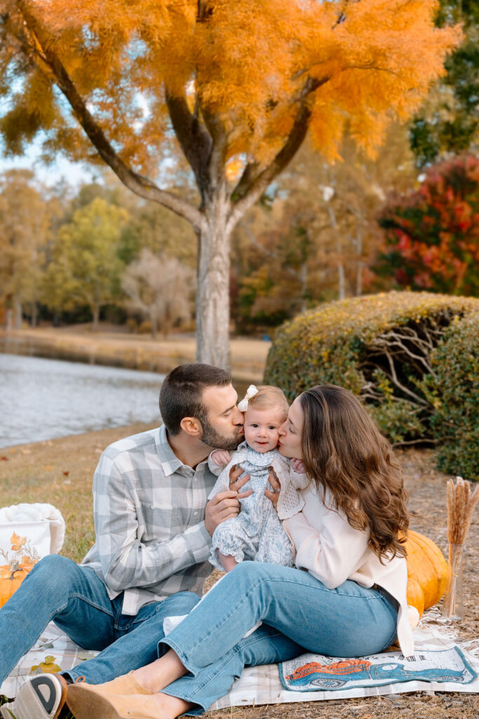 Young family photos with orange tree colors and peak foliage at Furman University, Greenville South Carolina
