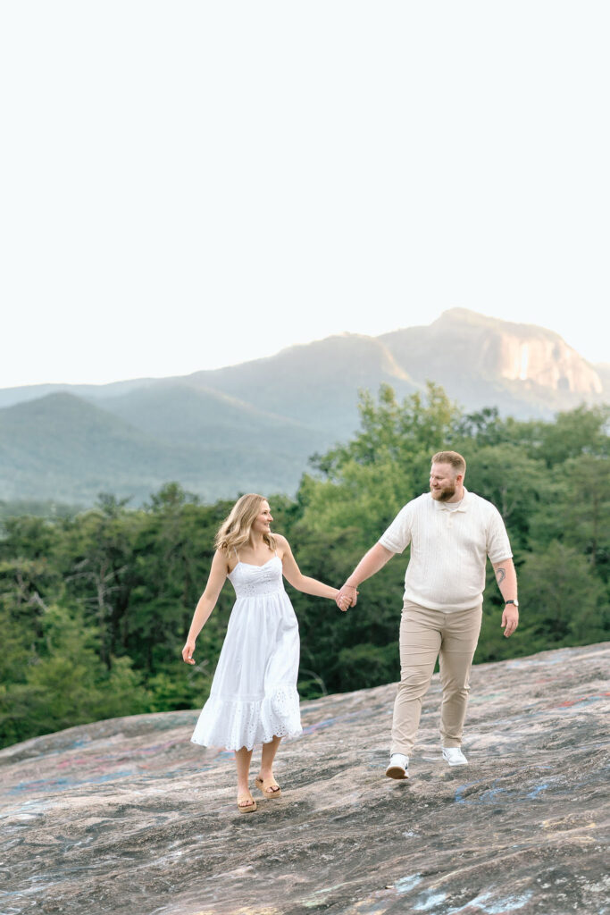 Couple at their engagement photos at Bald Rock outside Greenville South Carolina