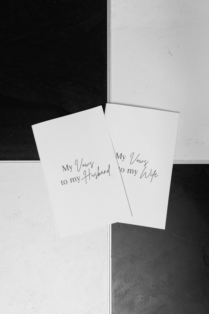 Elegant black and white wedding color palette with minimalist table design and modern black tie details
