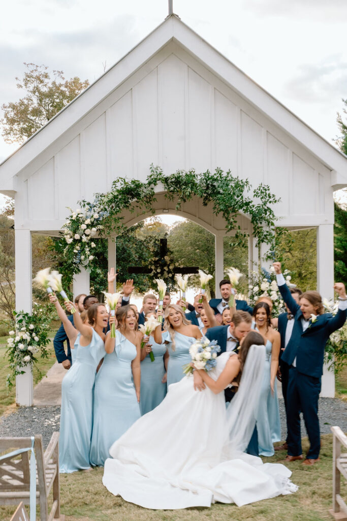 Modern cobalt blue wedding color palette with bridesmaid dresses and floral accents at an outdoor South Wind Ranch wedding