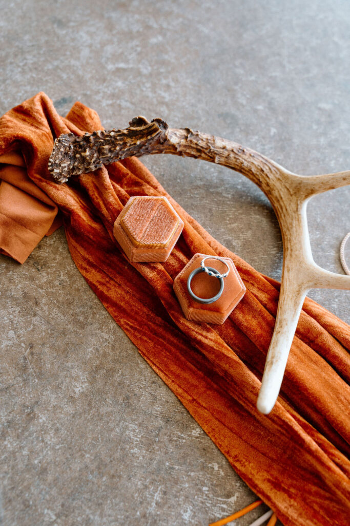 Warm terracotta wedding color palette with earthy florals and neutral table styling for a fall wedding
