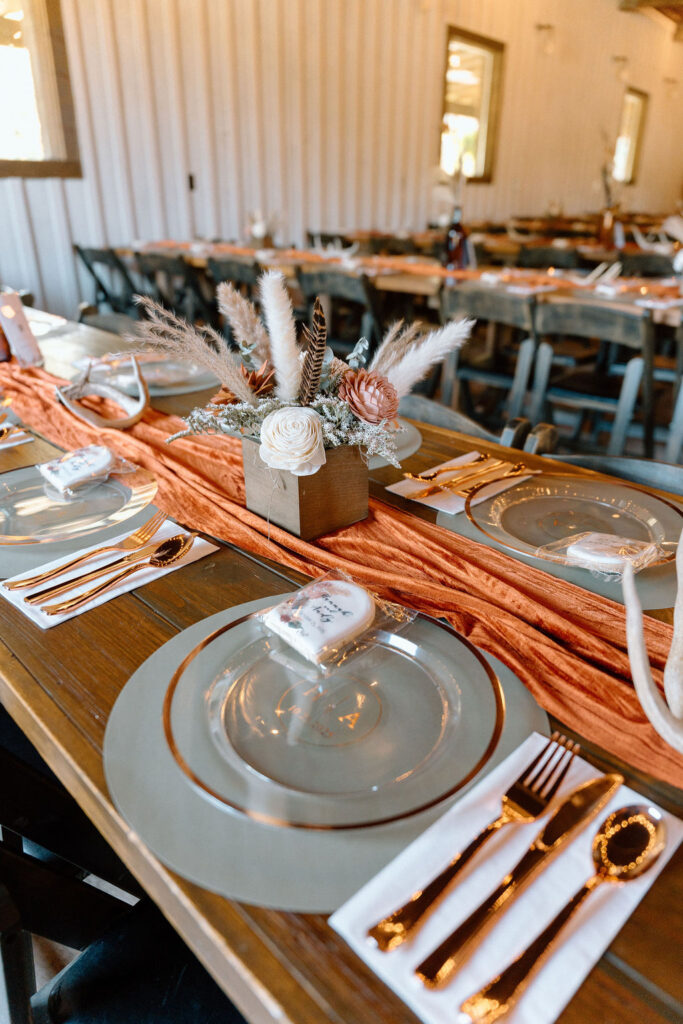 Warm terracotta wedding color reception table palette with neutral table styling for a fall wedding in Greenville South Carolina