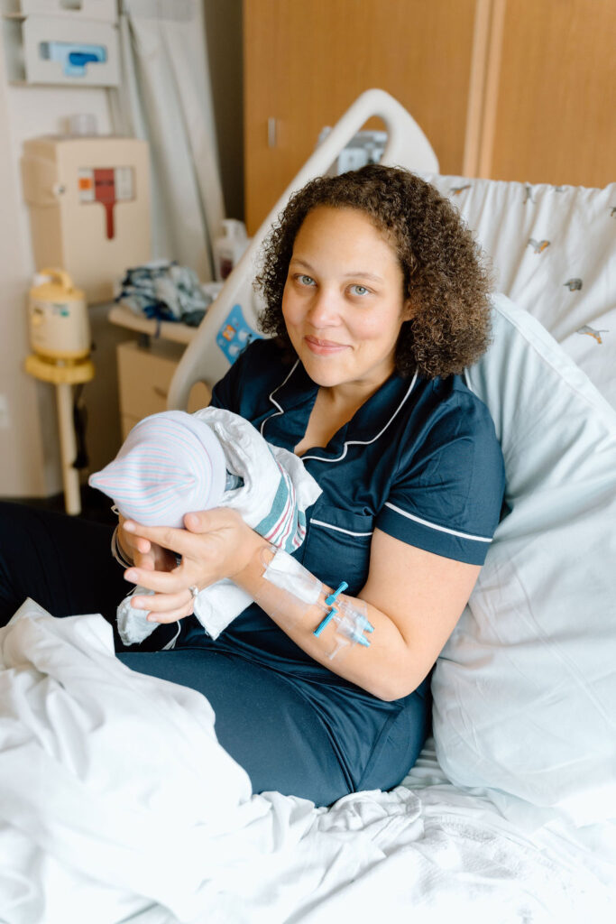 New mom holding newborn during Fresh 48 session at Greenville Memorial Hospital in Greenville SC
