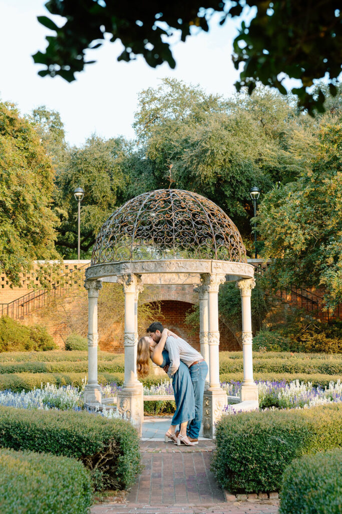 Romantic engagement session at Furman University Rose Garden with blooming roses
