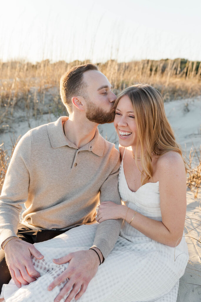 Coastal engagement portrait of Caroline and Jamie on the sandy shoreline near Charleston

