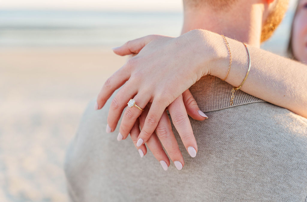 Close-up of Caroline’s engagement ring during a romantic Charleston engagement session
