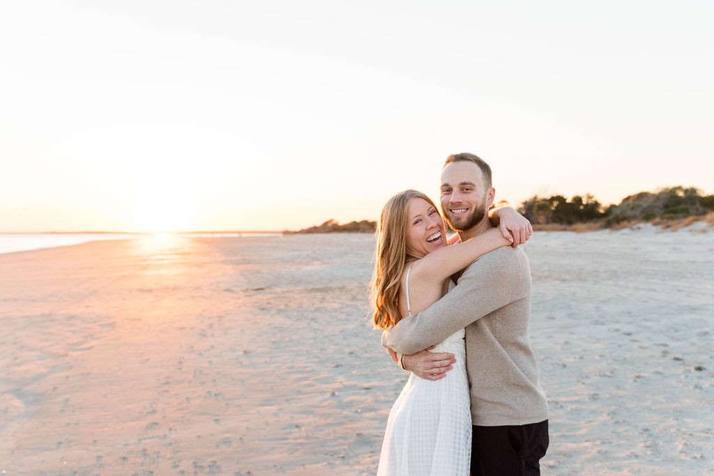 Joyful candid portrait of Caroline and Jamie during their Sullivan’s Island engagement session
