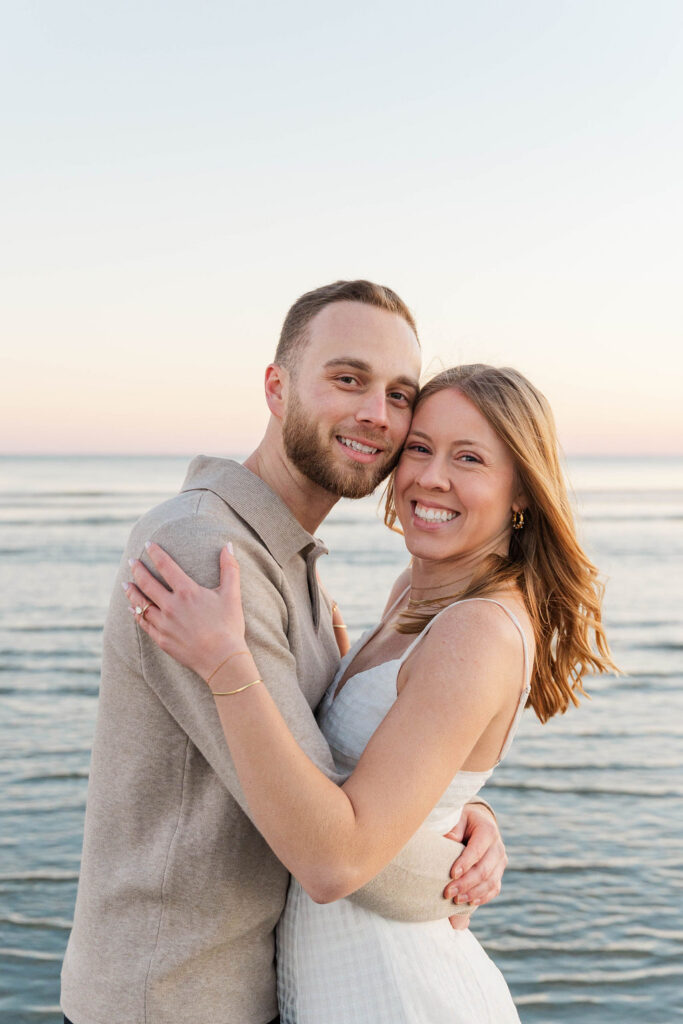 Romantic portrait of Caroline and Jamie on Sullivan’s Island beach during sunset engagement photos
